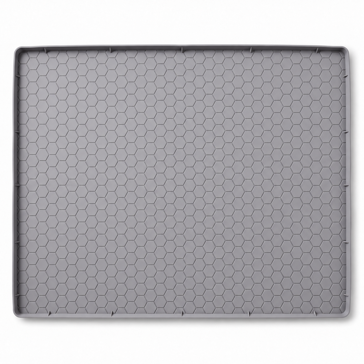 Gray silicone pet feeding mat with a honeycomb-textured surface and raised edge