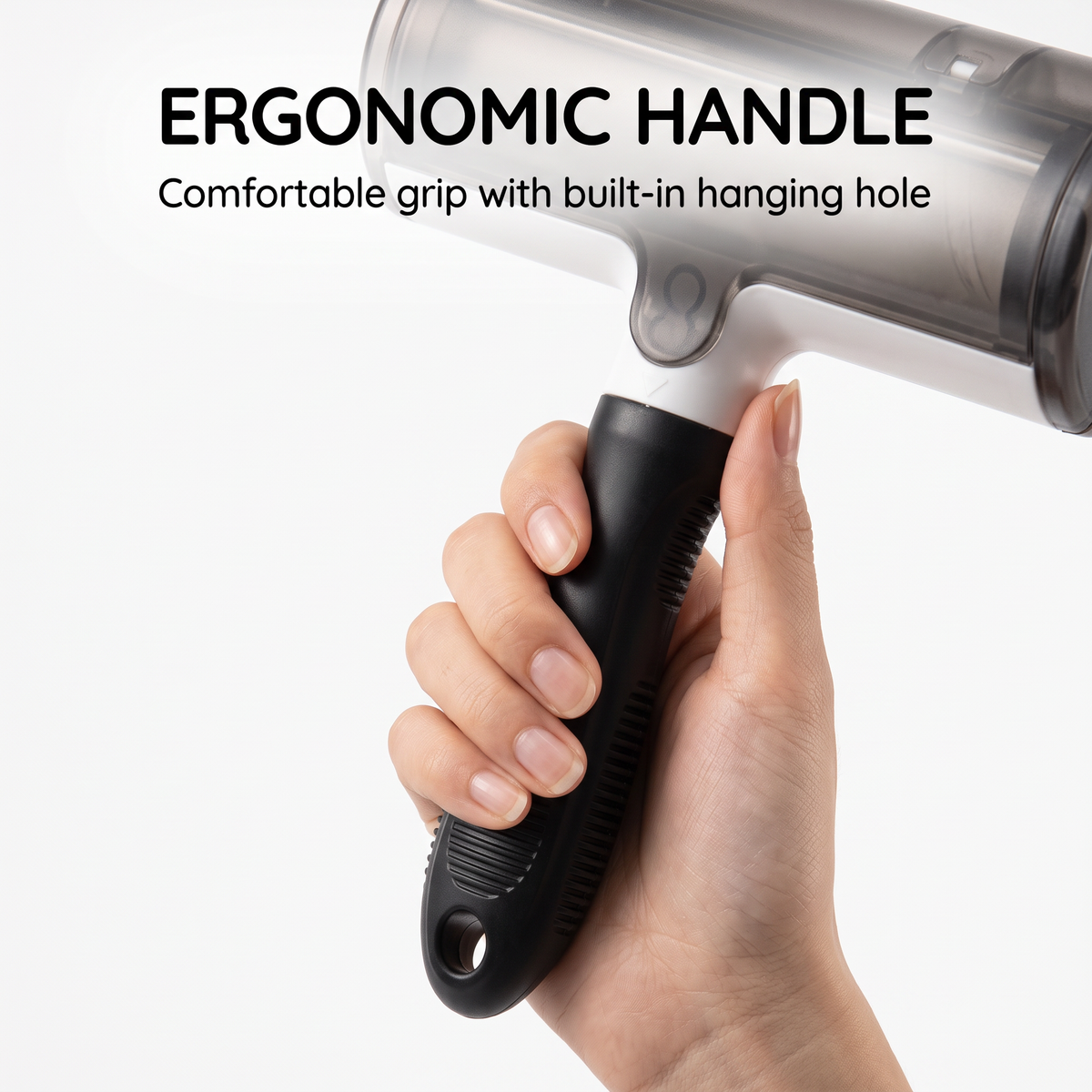 Close-up of the ribbed handle and hanging hole on a black and white pet hair remover roller