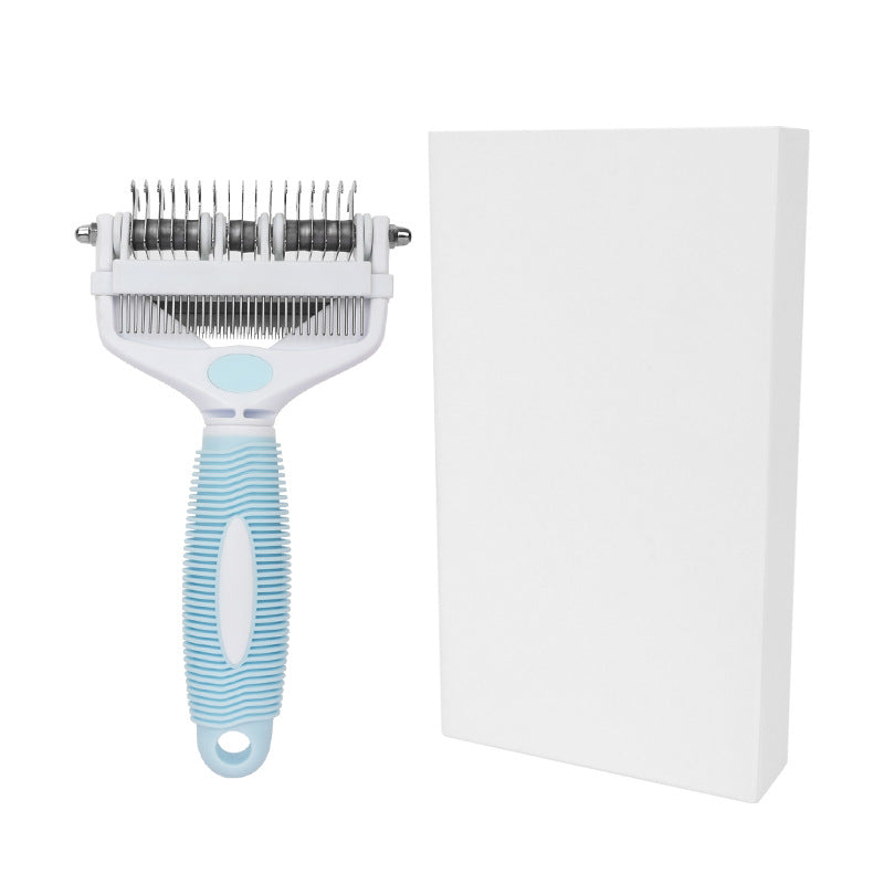 White and blue pet grooming comb beside a plain white retail box