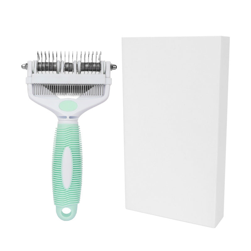 White and green pet grooming comb beside a plain white retail box