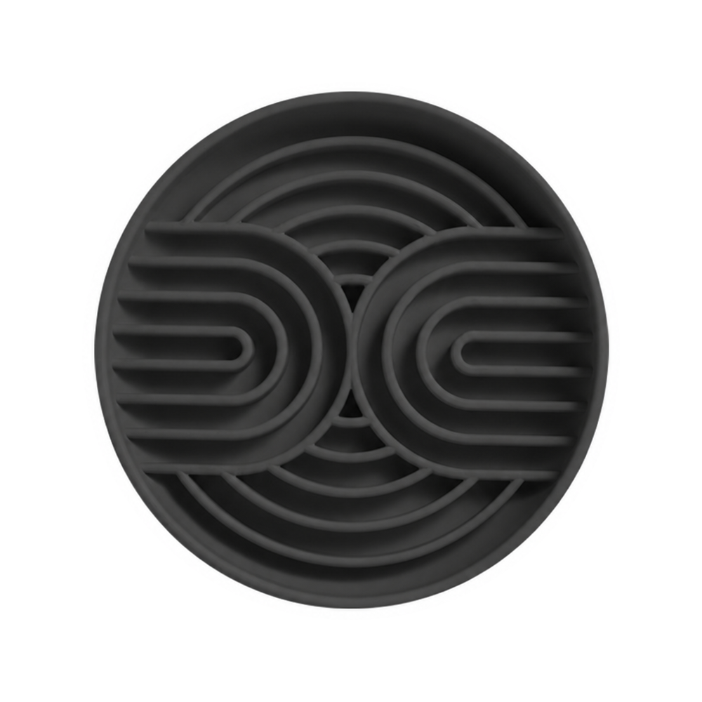 One dark gray silicone slow feeder bowl with curved channels on a white background