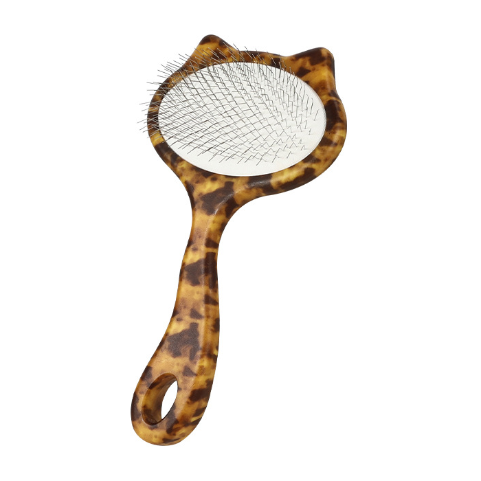 One large leopard-print cat-shaped slicker brush with metal pins on a white background