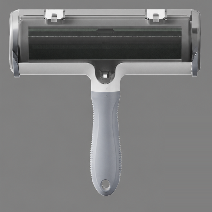 One gray and white pet hair remover roller with its attached handle on a gray background